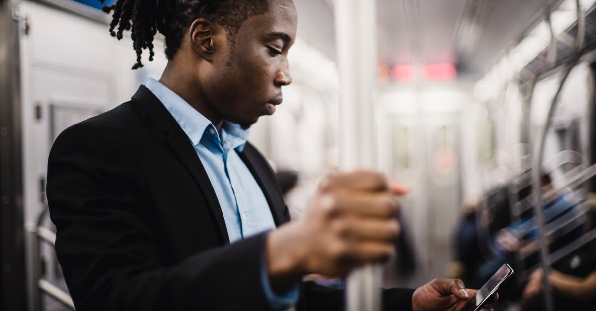 Can/should I use rapid rise yeast for longer proofing? - Young African American man using smartphone on train