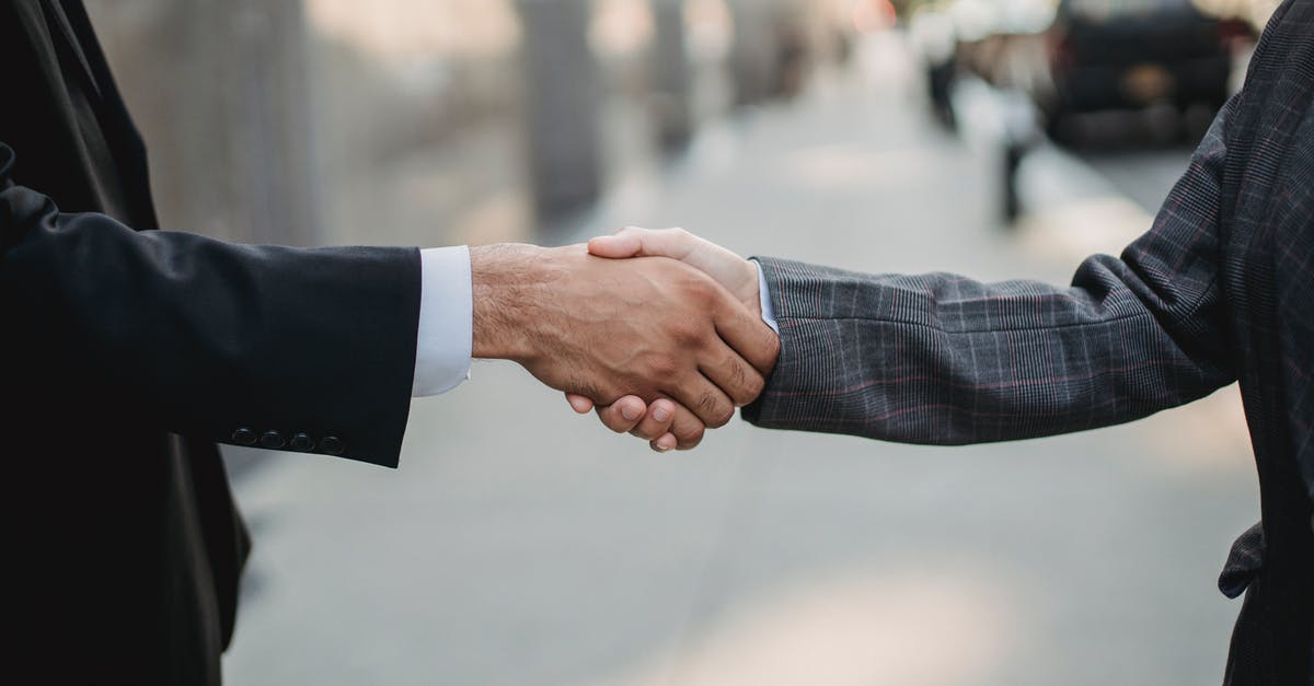 Carbonation diffuser versus shaking - Close-up of Business People Shaking Hands