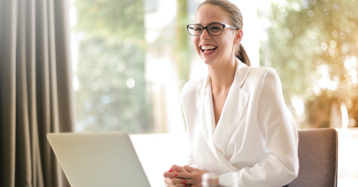 Casein content after curdling - Laughing businesswoman working in office with laptop