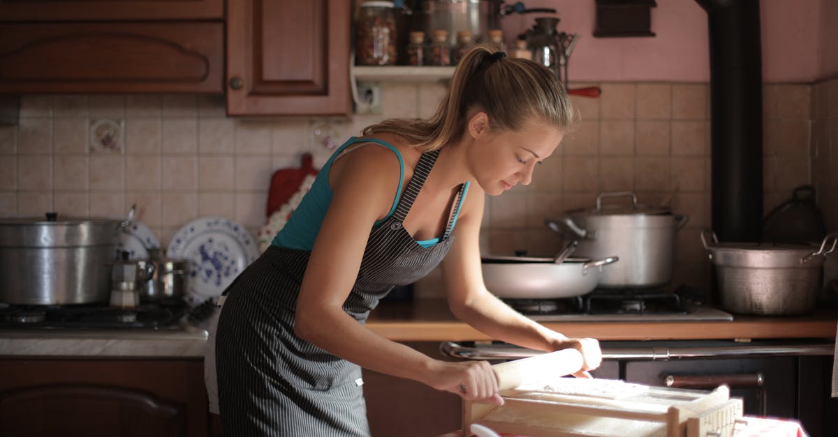 Cassolette Pans - Cooking on the Stovetop and in the Oven - Woman in Blue Tank Top Using a Rolling Pin