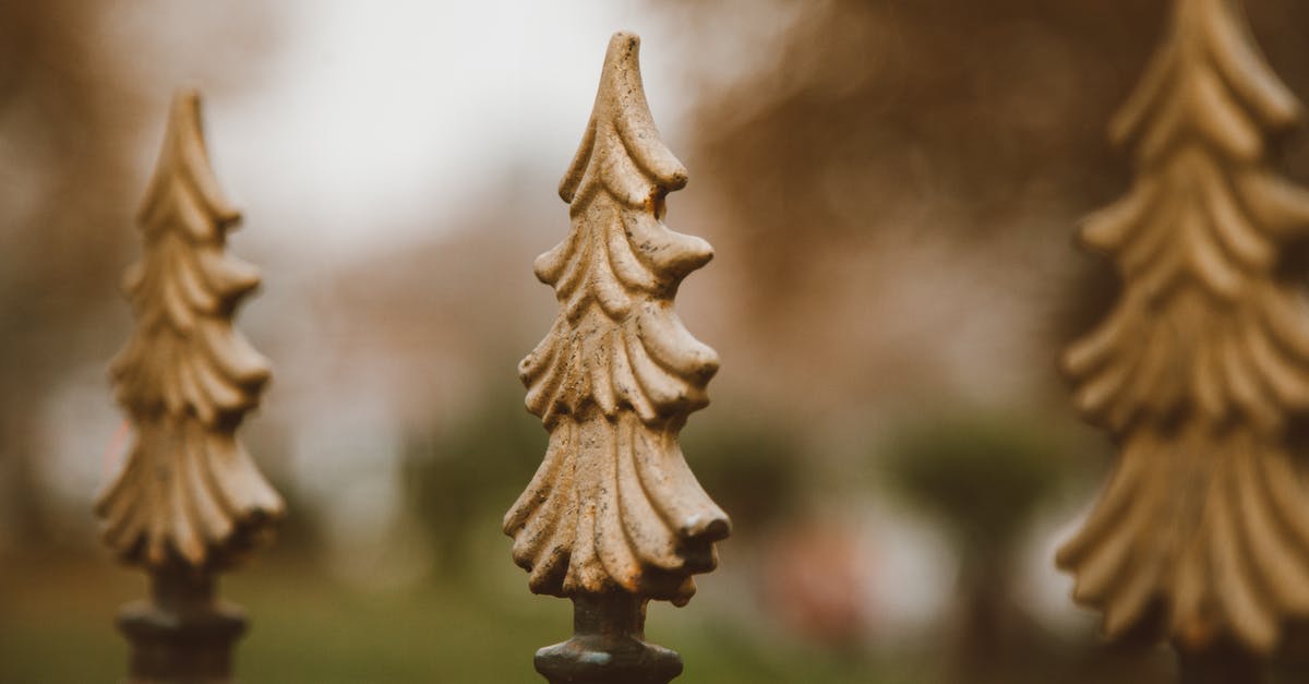 Cast iron cookware restoration - Pine Tree Shape Decors of an Iron Fence 