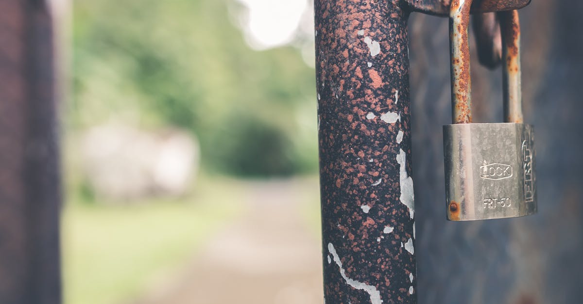 cast iron pan rusting on bottom surface - Rusted Grey Padlock in Selective-focus Photography