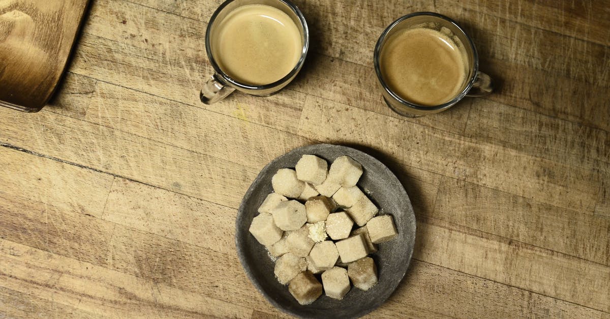 Caster Sugar Substitute - White and Brown Stones on Black Round Plate