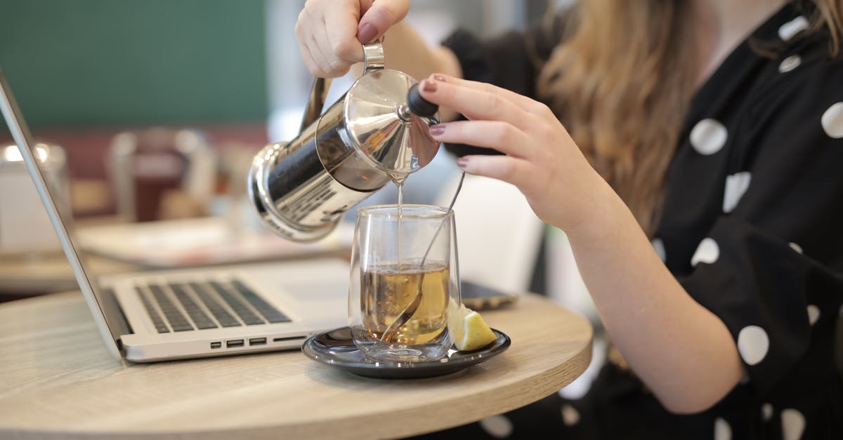 Category name for restaurants NOT dressing food? - Woman pouring hot tea from french press into glass cup