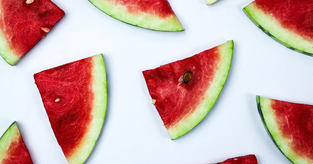 Cause of watermelon rind rotting (at room temperature) - Sliced Watermelon over White Table