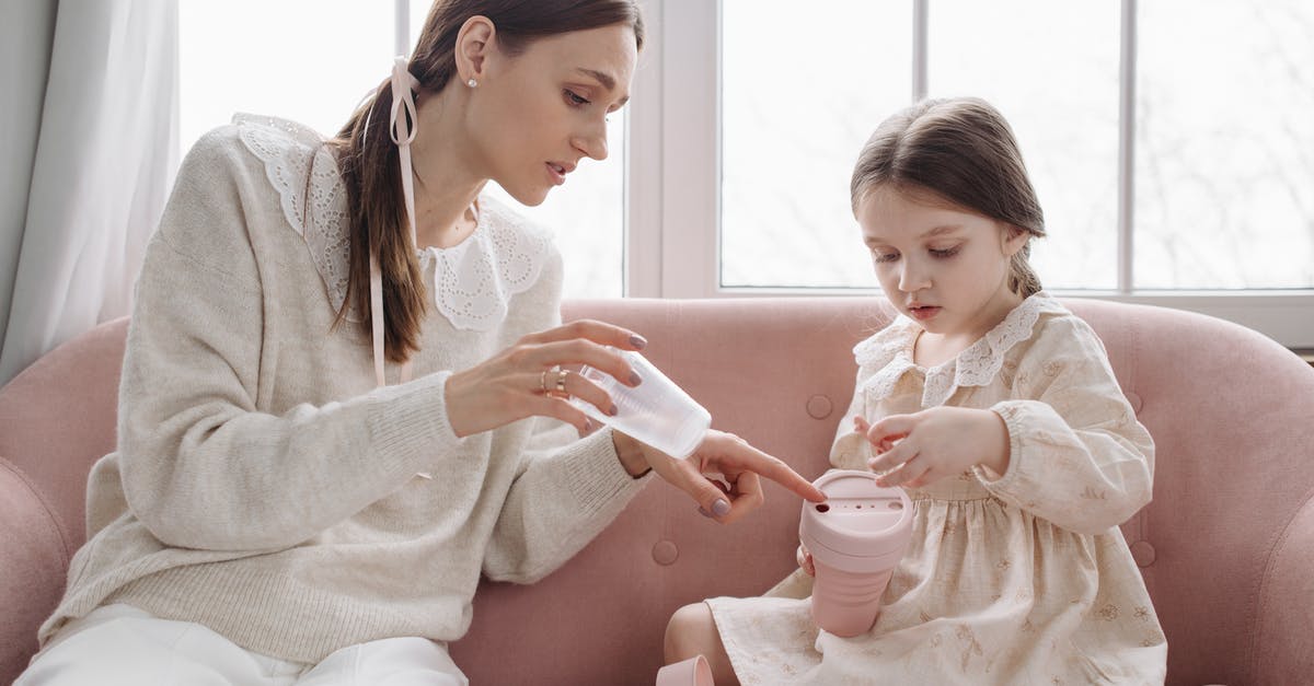 Cedar Planks - Reusable Vs. Disposable - Woman and Child Wearing Long Sleeves Holding Reusable Pink Mug