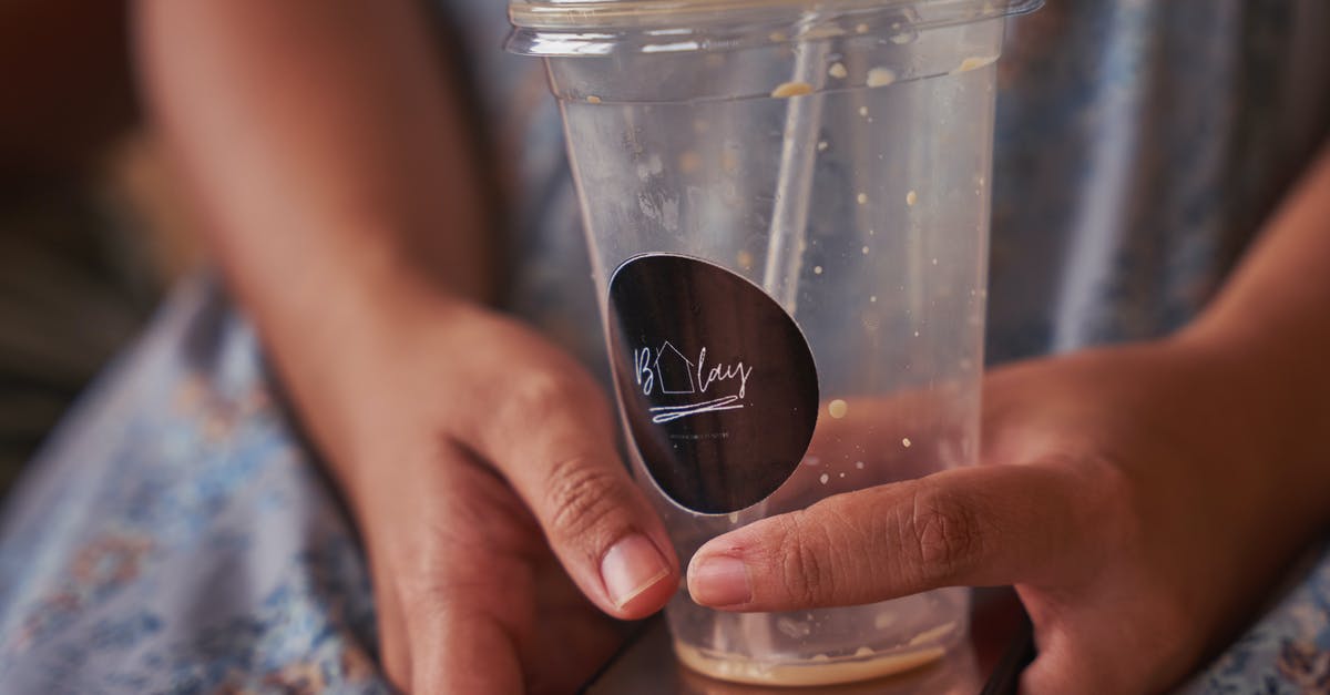 Cedar Planks - Reusable Vs. Disposable - Person Holding Clear Plastic Cup