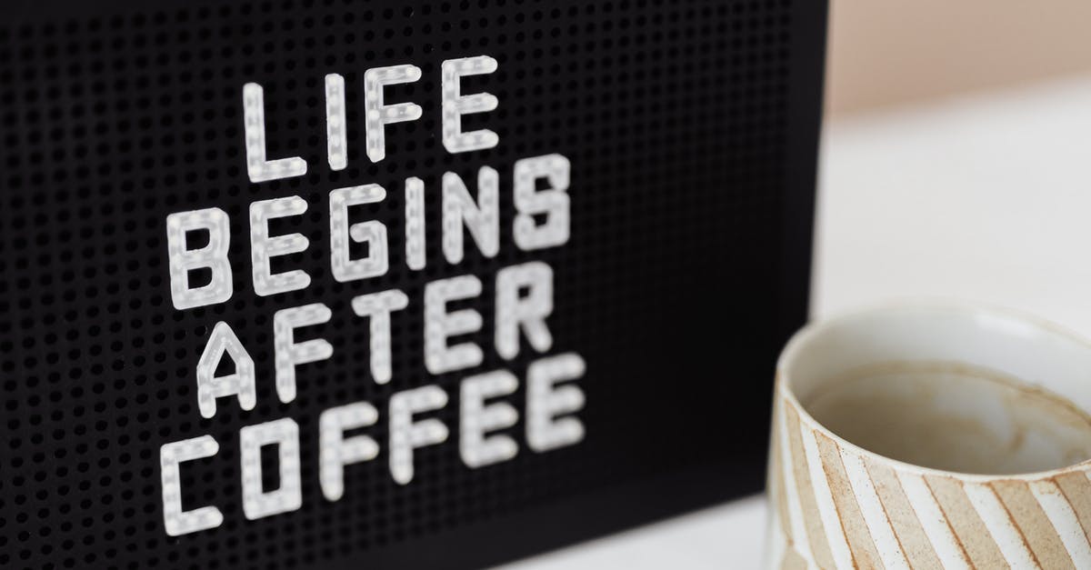 Ceramic Cooktop (non induction) getting damaged after use - Peg message board with Life Begins After Coffee motto and empty ceramic cup of coffee with creative striped design on white table