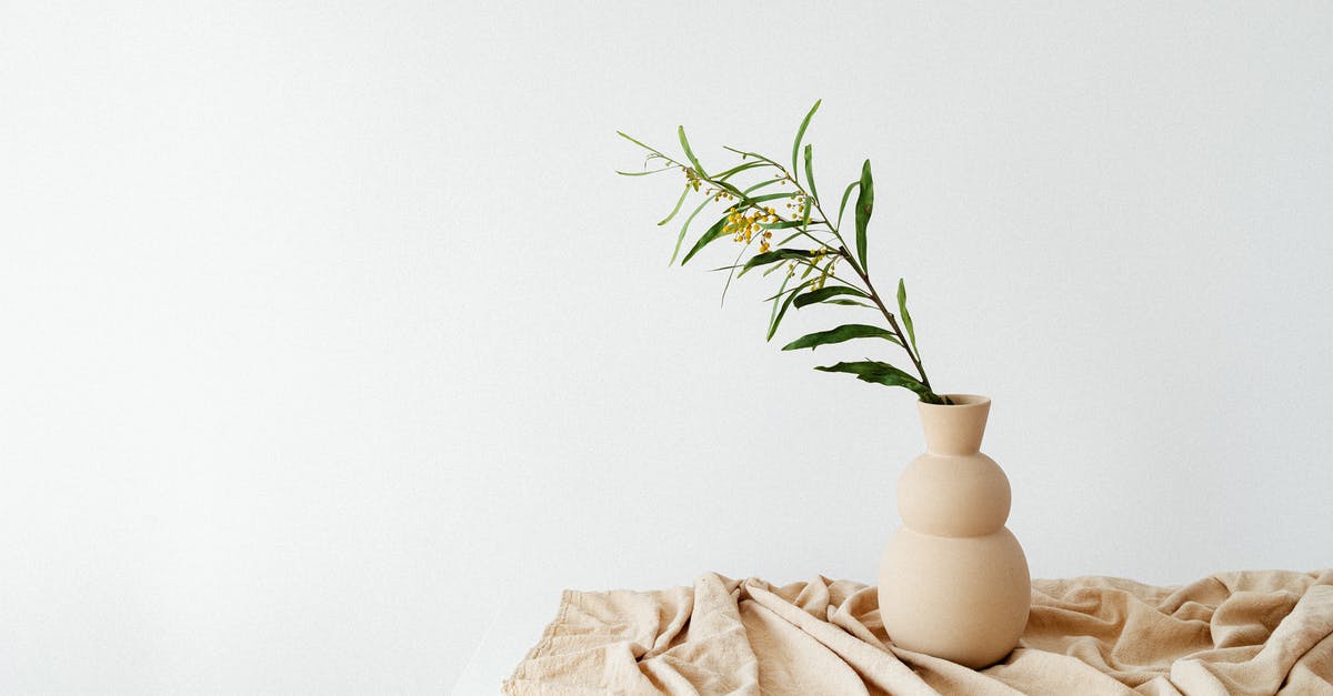 Ceramic knives for boning? - White Pillar Candle on White Bed