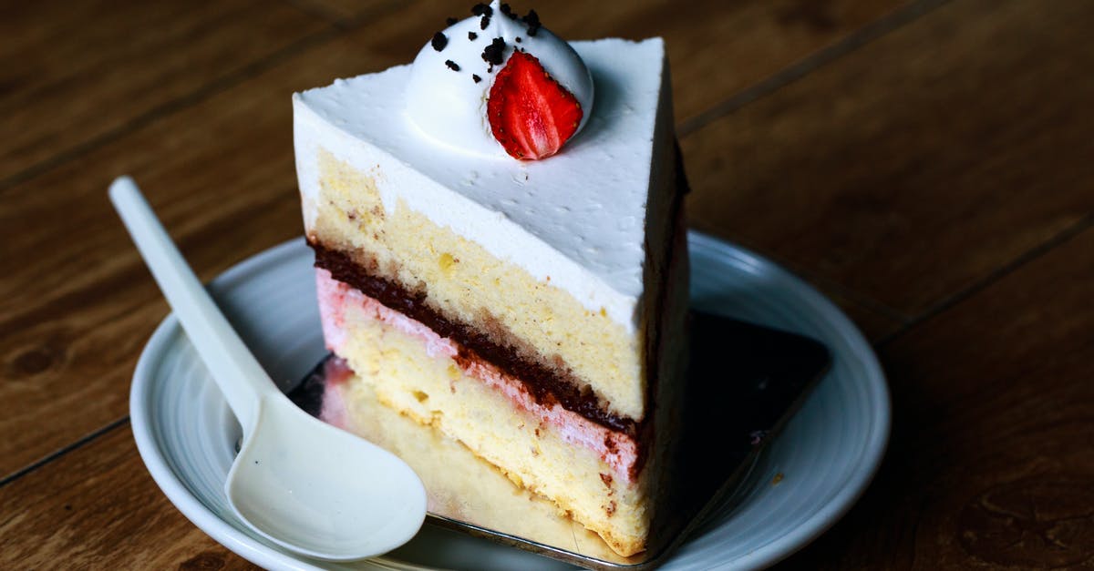 Cheesecake- adding cream - Sliced Cake on White Saucer