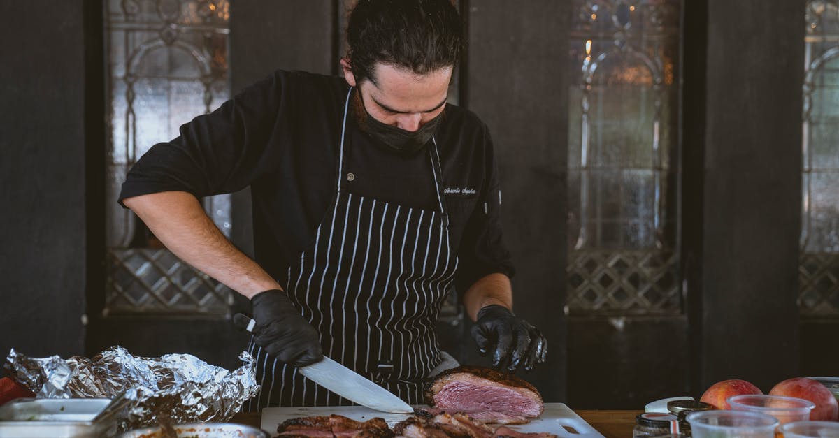 chef's knife for cutting chicken, or butcher's - Man Wearing an Apron Cutting a Streak