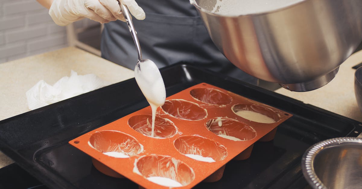 Chef at restaurant seemed to be using really flimsy pans - Photo Of Person Holding Spoon