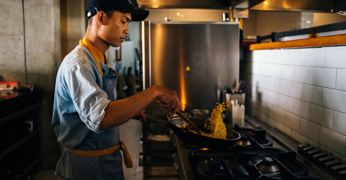 Chef at restaurant seemed to be using really flimsy pans - A Chef in Action Cooking Fried Rice