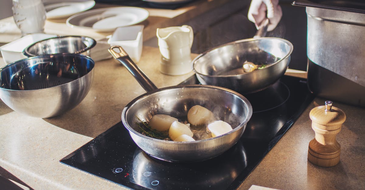 Chef at restaurant seemed to be using really flimsy pans - Photo Of Man Holding Pan 