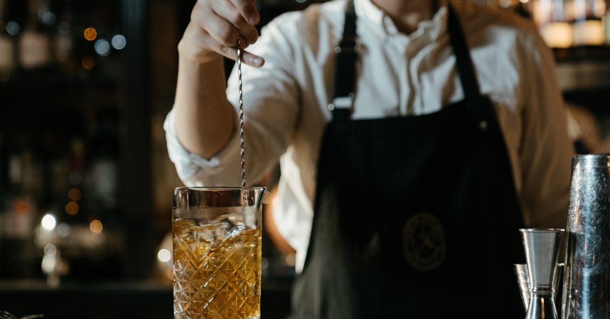 Chemical process behind hardening ice cream - Man in White Shirt Holding Clear Drinking Glass