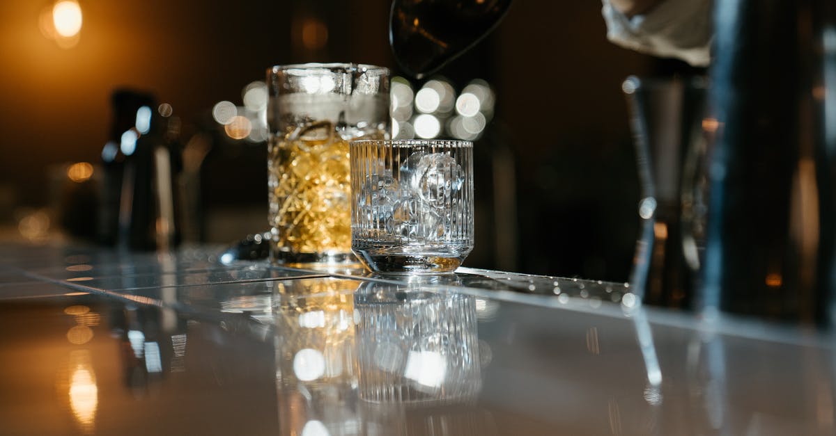 Chemical process behind hardening ice cream - Clear Glass Cup on Clear Glass Table