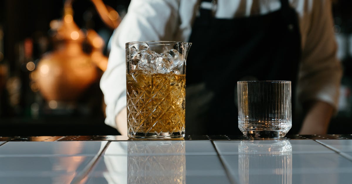 Chemical process behind hardening ice cream - Clear Drinking Glass With Brown Liquid