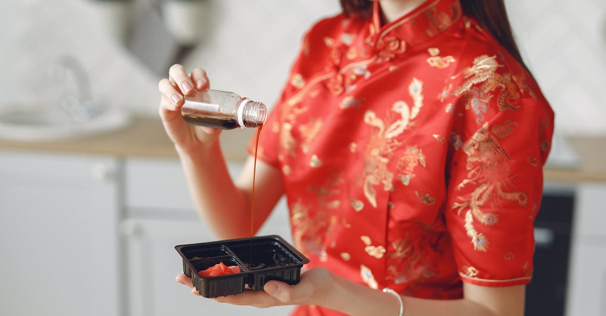 Chicken marinade with soy sauce - have I done something wrong? - Crop woman pouring soy sauce to capacity for sauce