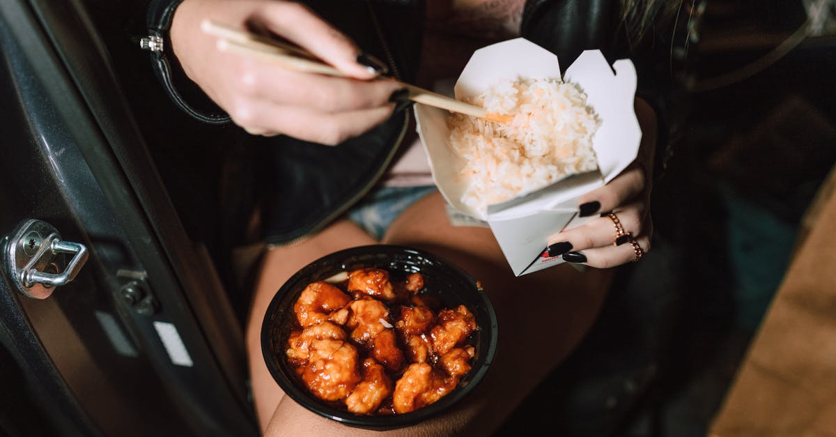 chicken texture after precooking starts to break - Unrecognizable woman eating delicious takeaway Asian dishes