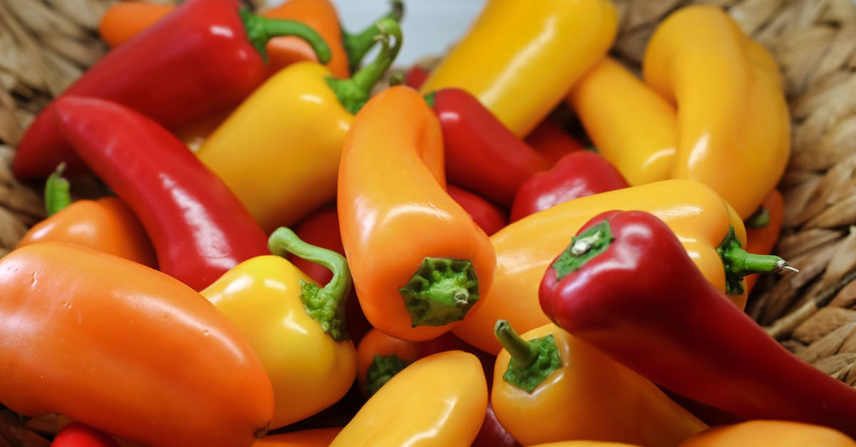 Chili ended up tasting like indian food - Shallow Focus Photography of Yellow and Red Bell Peppers in Basket