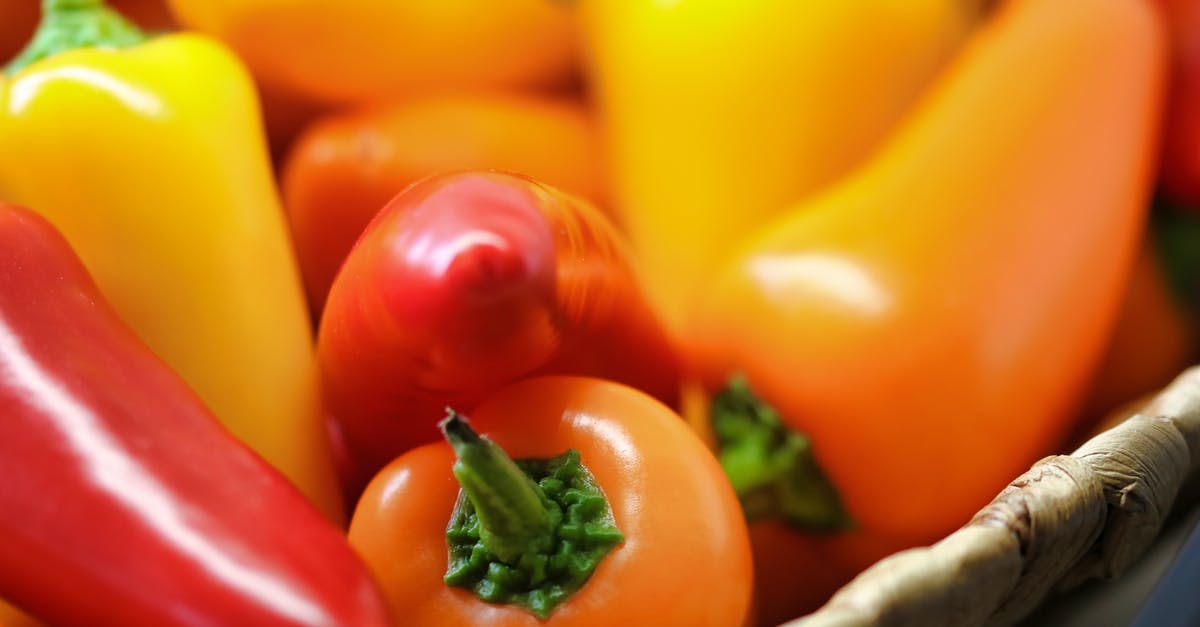 Chili ended up tasting like indian food - Close-up Photo of Orange and Red Bell Peppers