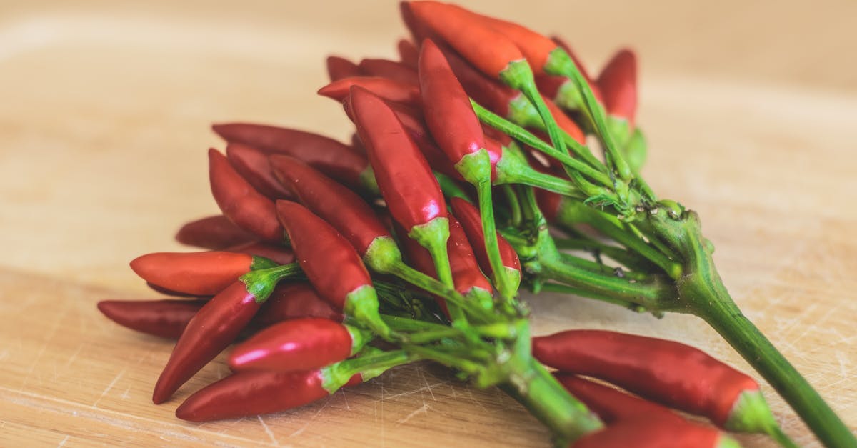 Chili ended up tasting like indian food - Red Chili Peppers on Brown Wooden Surface