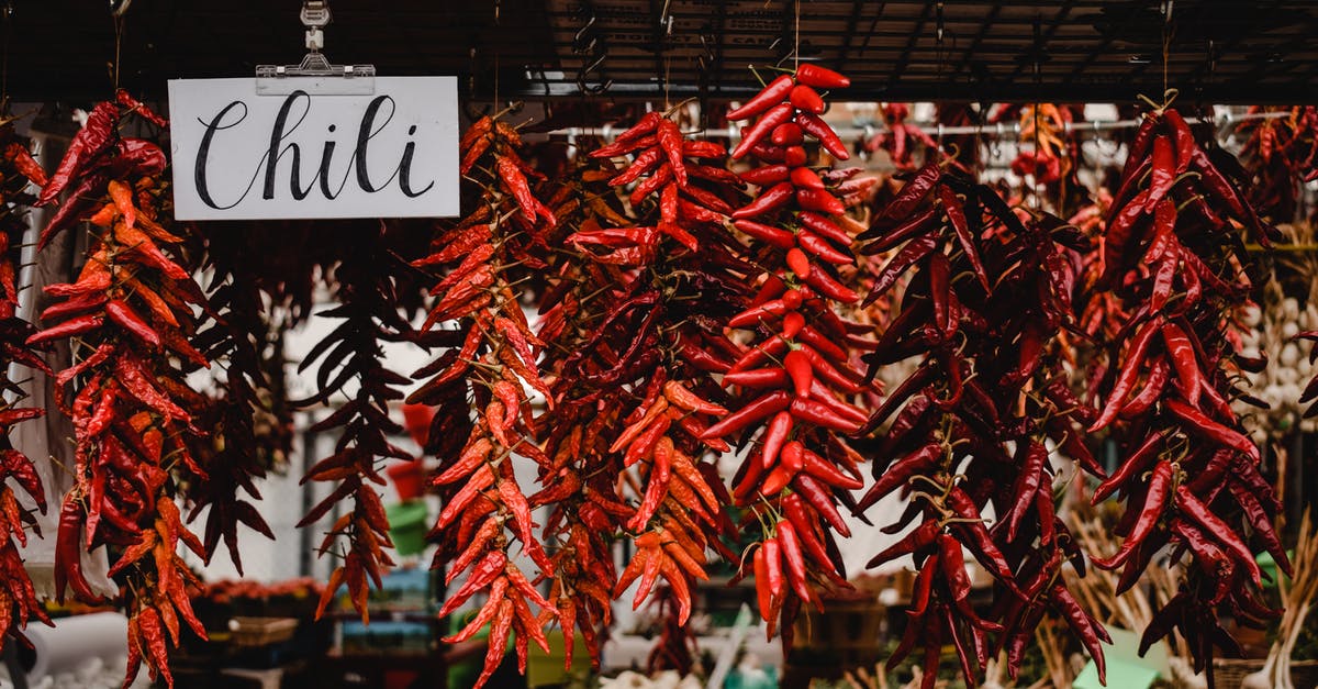 Chili pepper size vs heat - Red Chili on Brown Wooden Table