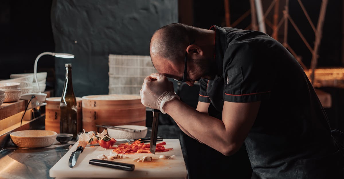 Chinese cooking wine varieties - Man in Black T-shirt Sitting at Table