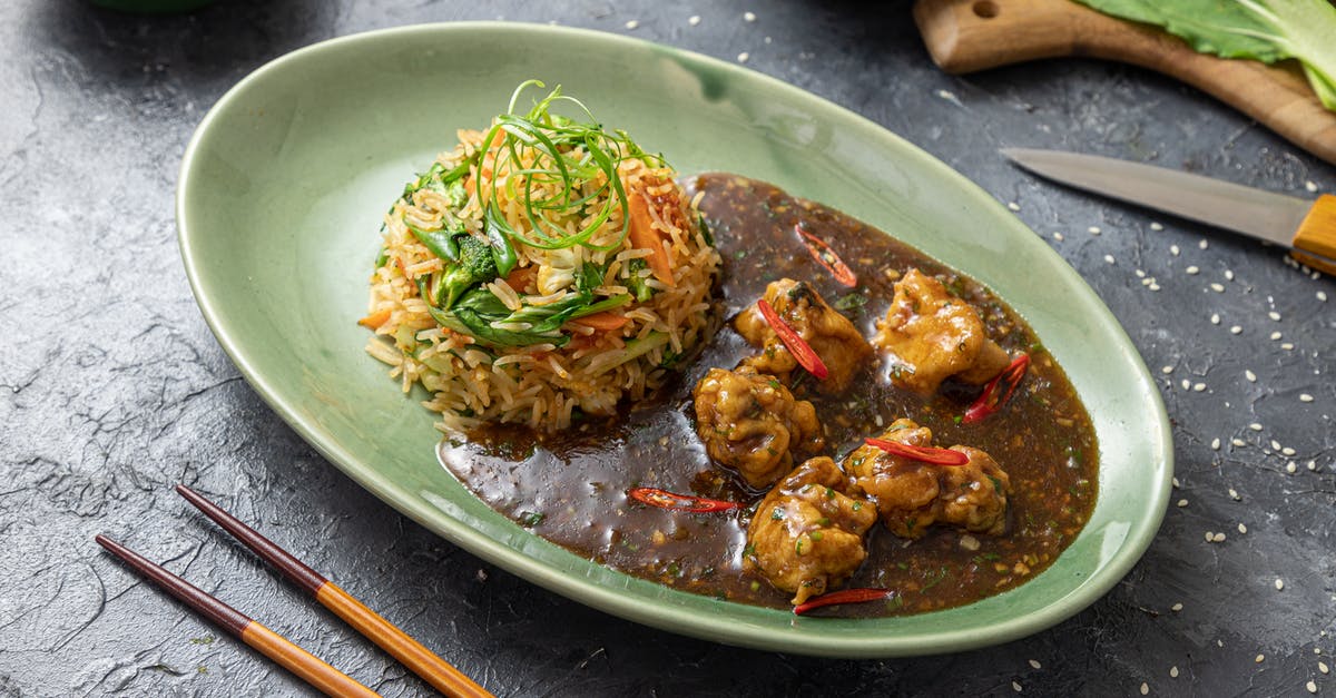 Chinese rice vermicelli tastes of chemicals - Rice Meal with Brown Sauce on Oval Plate