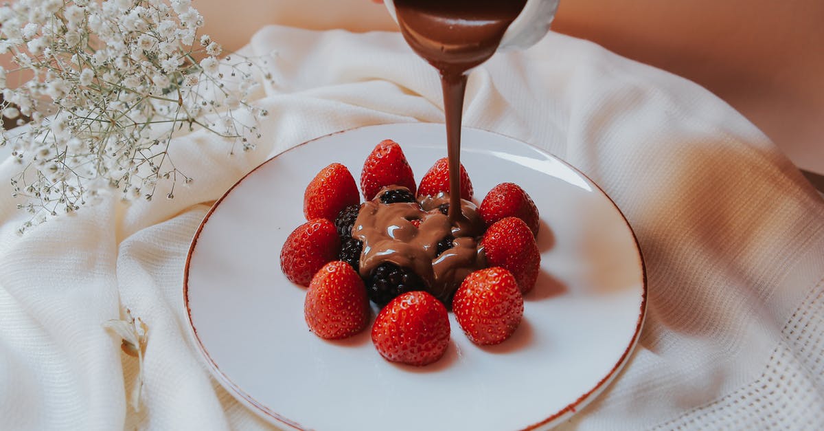 Chocolate ganache - Pouring of Chocolate Ganache on Berries