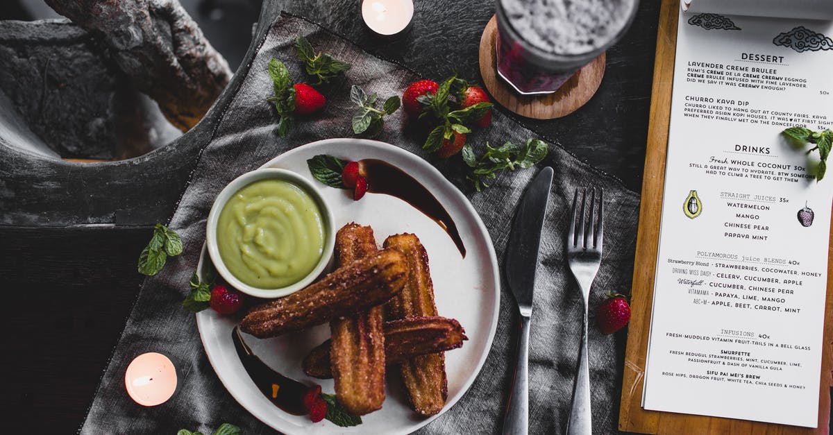 Chocolate hazelnut: efficacy of mixing crushed&roasted hazelnuts to sauce - Churro with avocado sauce and lavender dessert served on table