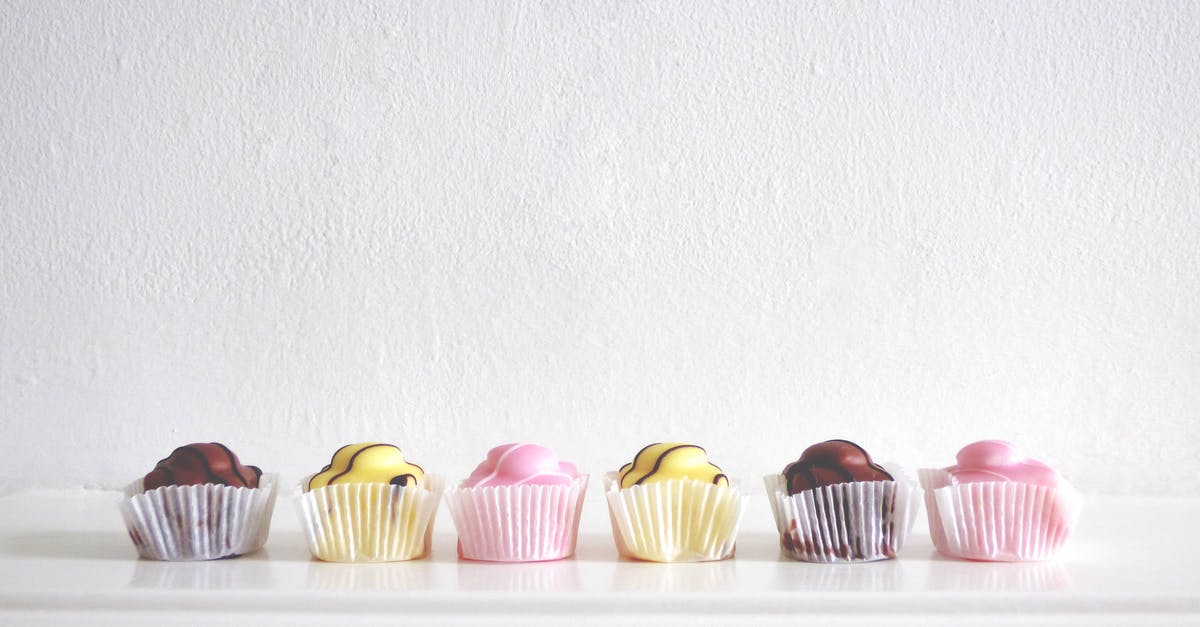 Chocolate loses its flavor and texture - Six Cupcakes Near White Wall Chocolate loses its flavor and texture - Six Cupcakes Near White Wall