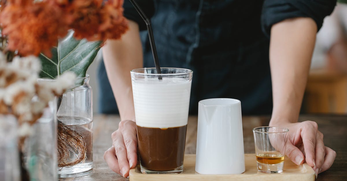 Chocolate Shot Glasses - Crop unrecognizable woman serving iced coffee with shot of cognac