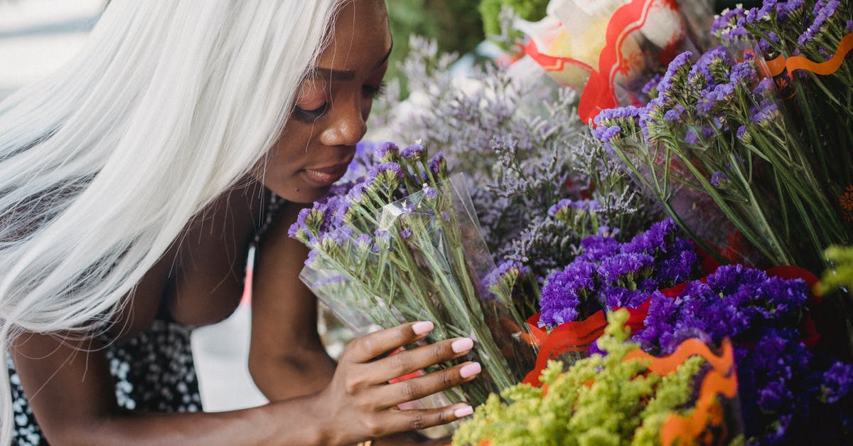 Choosing between semolina and non-semolina durum flour - Woman in Black and White Polka Dot Shirt Holding Bouquet of Flowers