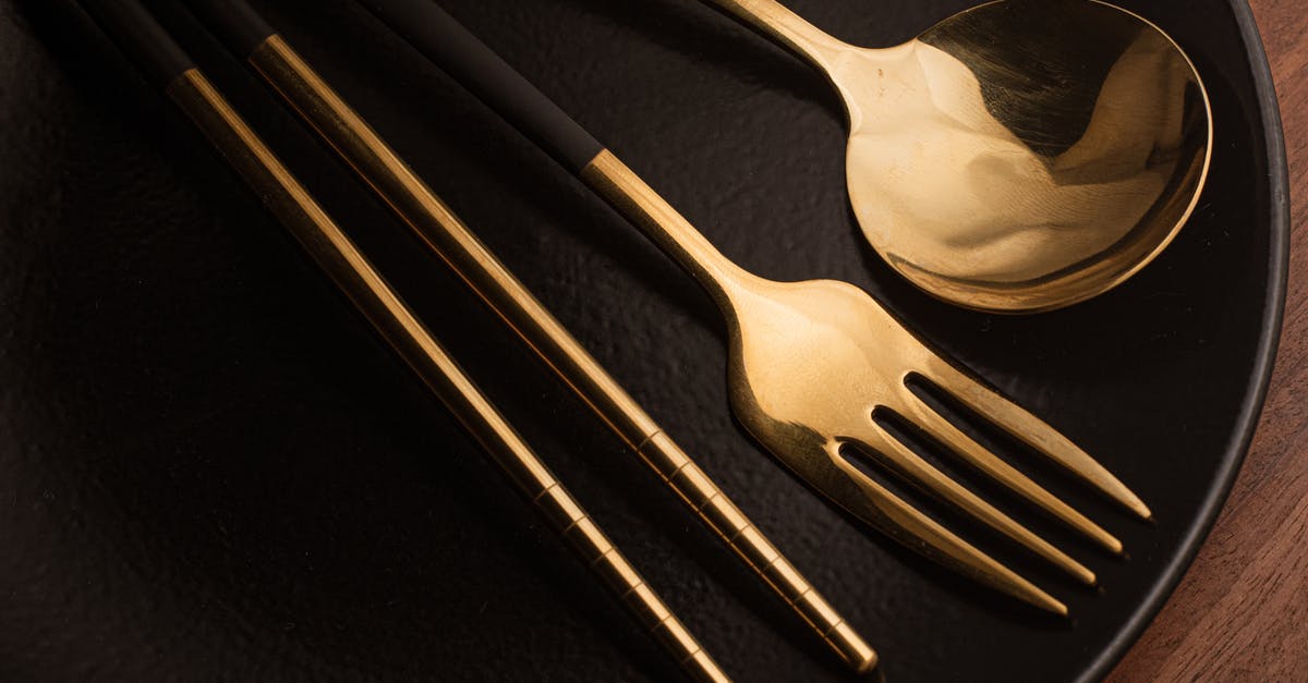 Chopsticks versus forks? - Silverwares on a Black Ceramic Plate