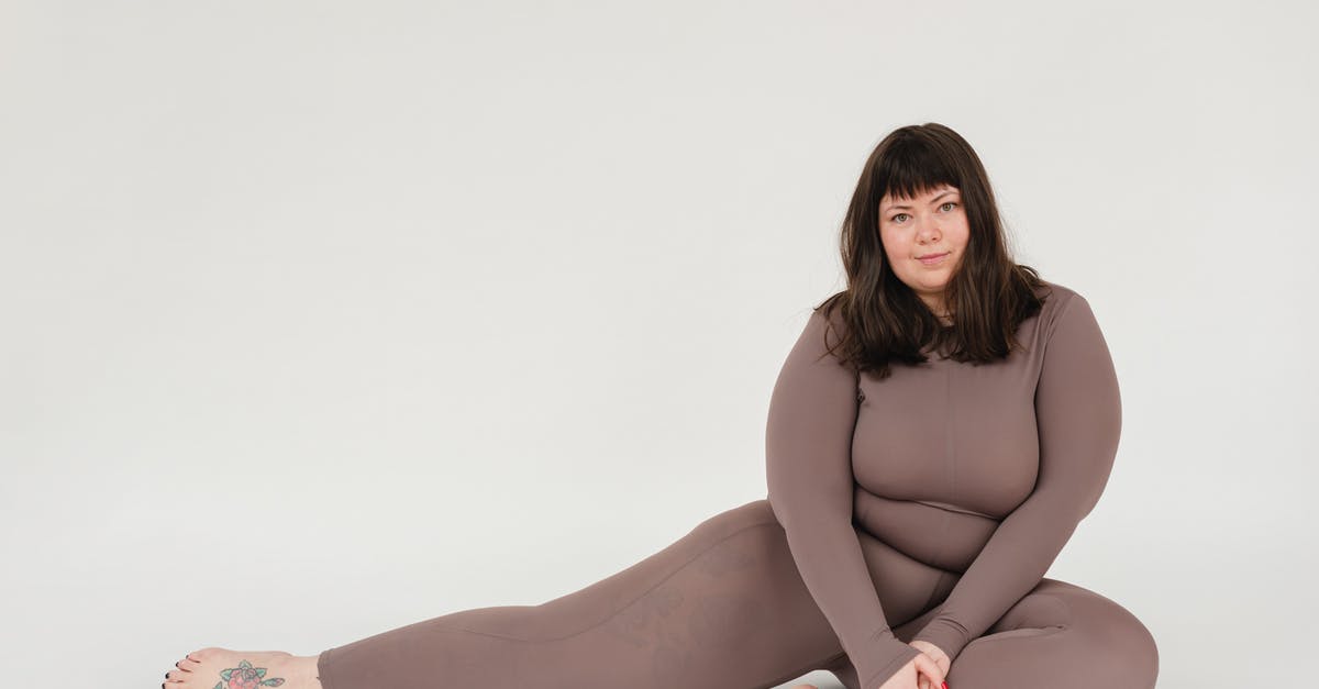 Chunky Peanut Butter - Overweight woman in activewear sitting in studio during training