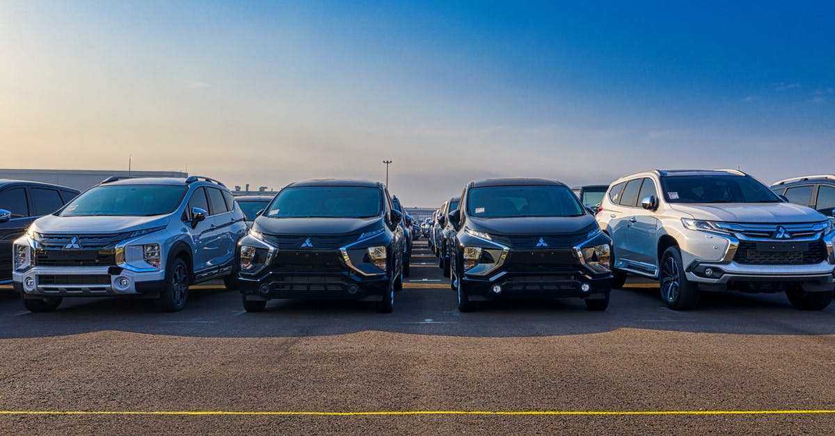 Cleaning bacon in new cast iron - Modern SUV cars parked in row