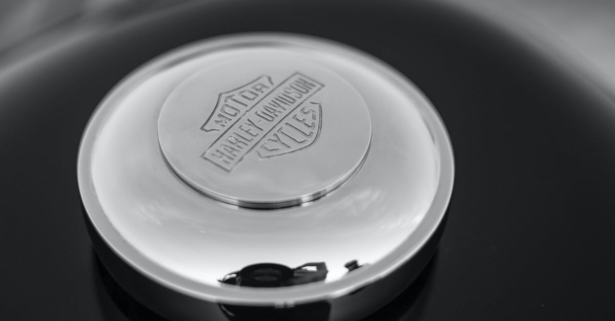 Cleaning silver with aluminum - Close-up Photo of Silver Harley Davidson Metallic Gas Cap