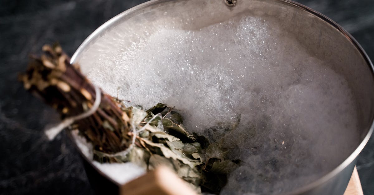 Cleaning tin discoloration on copper/tin lid - Soaking Dried Leaves in a Bucket Filled with Bubbles Soap