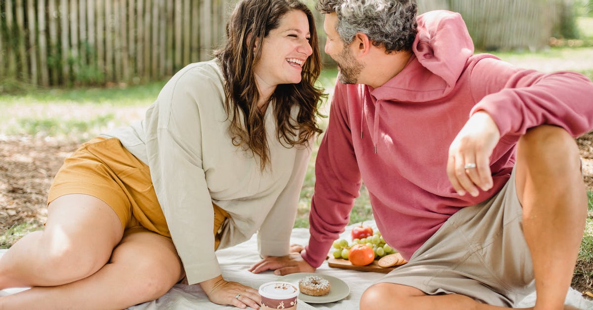 Closest thing to a donut I can drink coffee out of - Happy couple enjoying picnic together