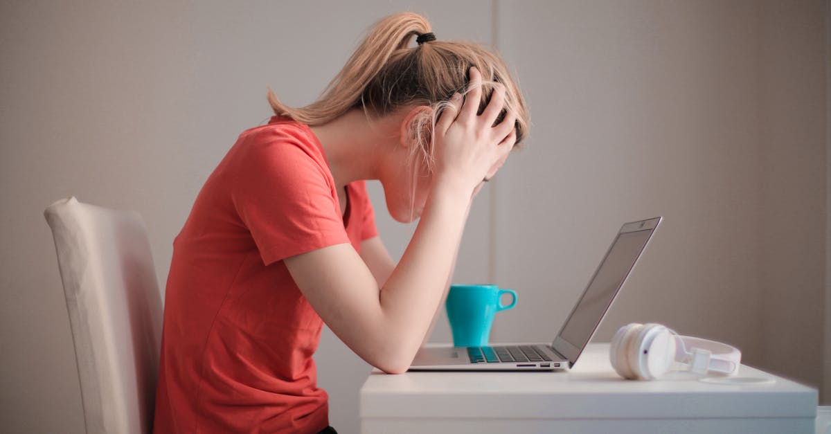 Cocoa powder stays stuck at the bottom of the cup [duplicate] - Woman in Red T-shirt Looking at Her Laptop