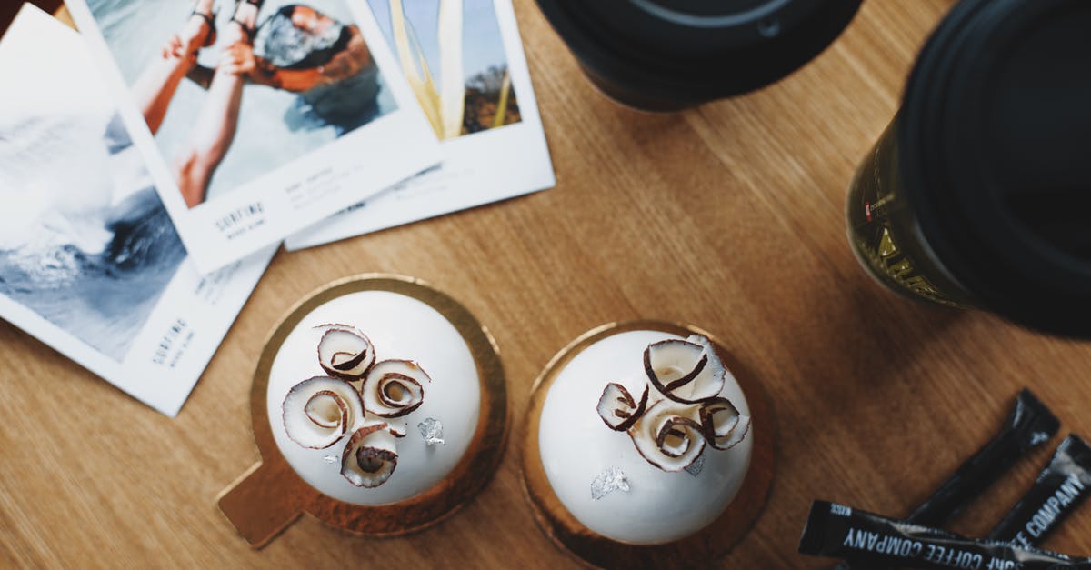 Coconut Cookies have bitter underlying taste - Coconut sweets and takeaway coffee on table of modern cafe