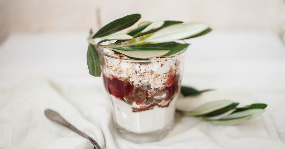 Coconut yoghurt too thick - Delicious dessert in glass with olive leaves