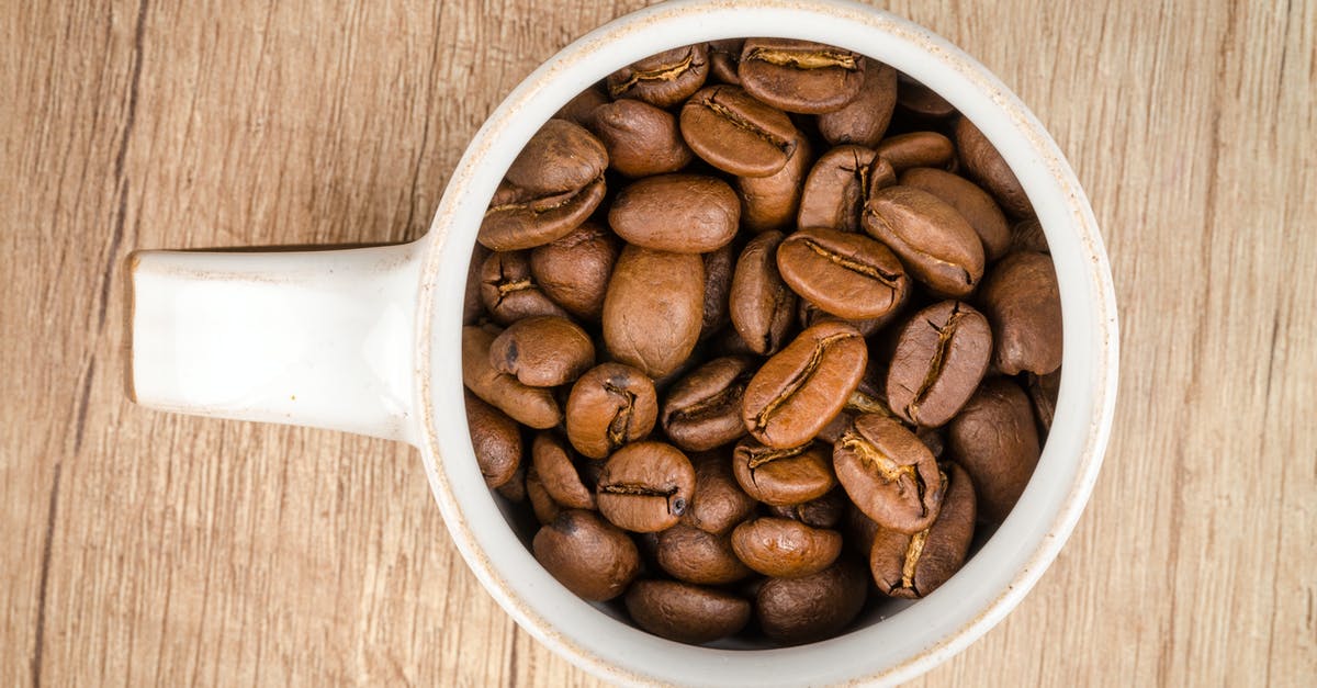 Coffee roasting, worth upgrade from popcorn popper - Roasted Coffee Beans Inside White Ceramic Mug