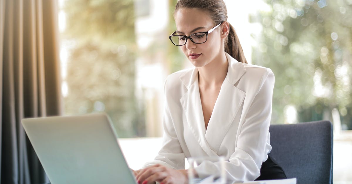 Coffee Soluability/Concentration - Concentrated female entrepreneur typing on laptop in workplace