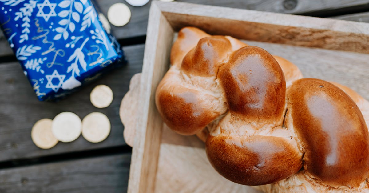 Coins in bread? - Top View Photo Of Bread Beside Gift