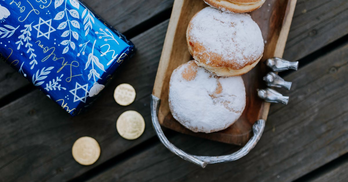 Coins in bread? - Photo Of Doughnuts On Top Of Wooden Table