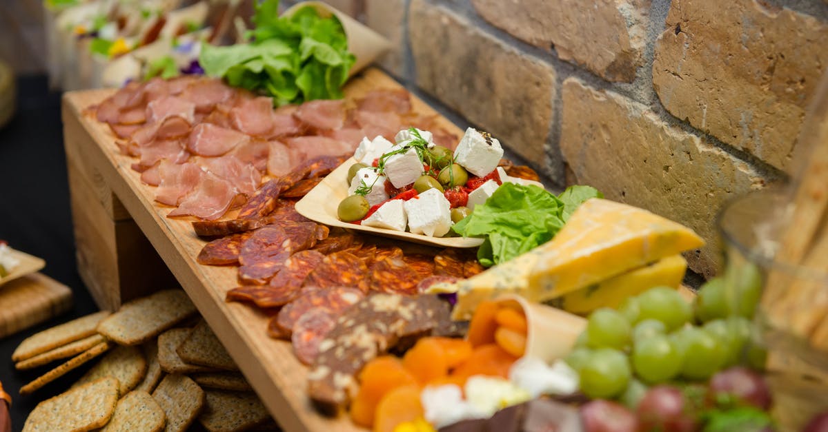 Cold smoked bacon biltong safety - Buffet with various sausages and cheese on sideboard