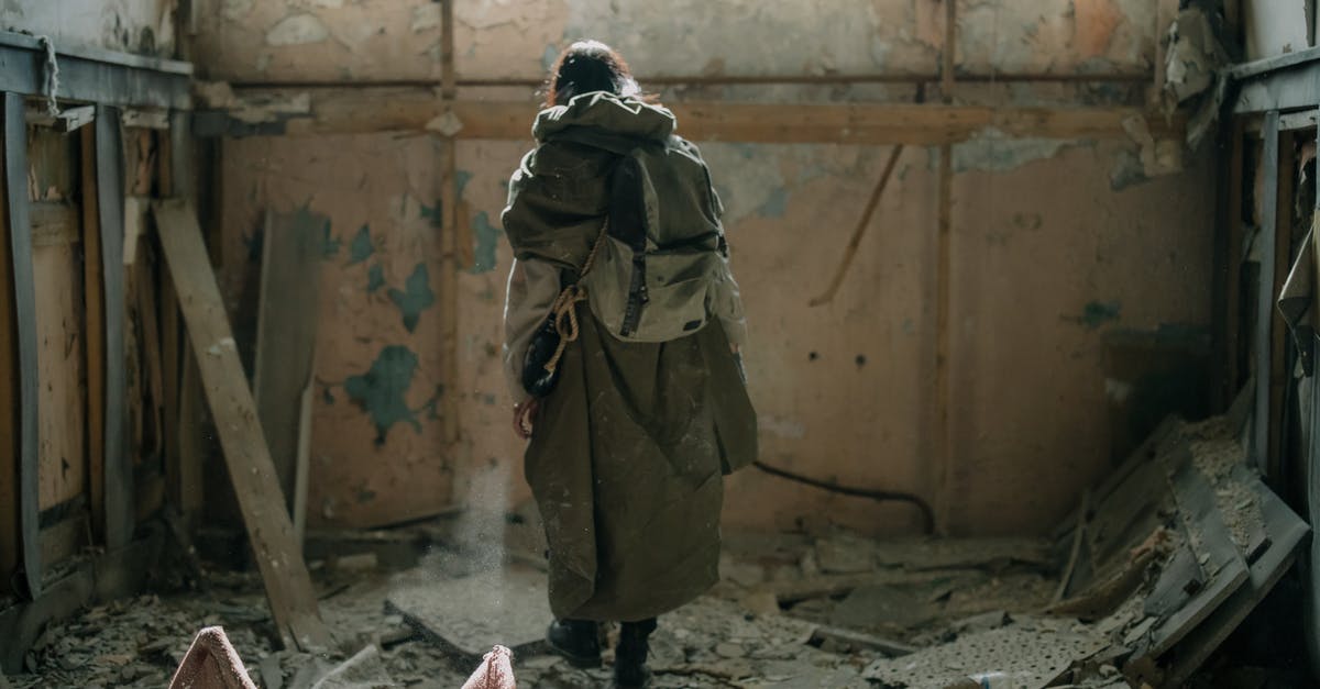 Collapsing soufflé - Person in Brown Coat and Black Pants Standing on Gray Concrete Floor