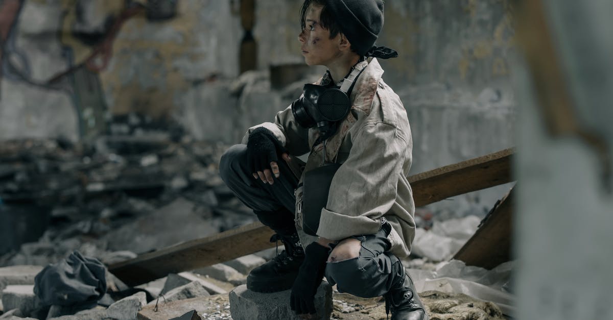 Collapsing soufflé - Boy in Brown Jacket and Black Helmet Sitting on Brown Wooden Bench